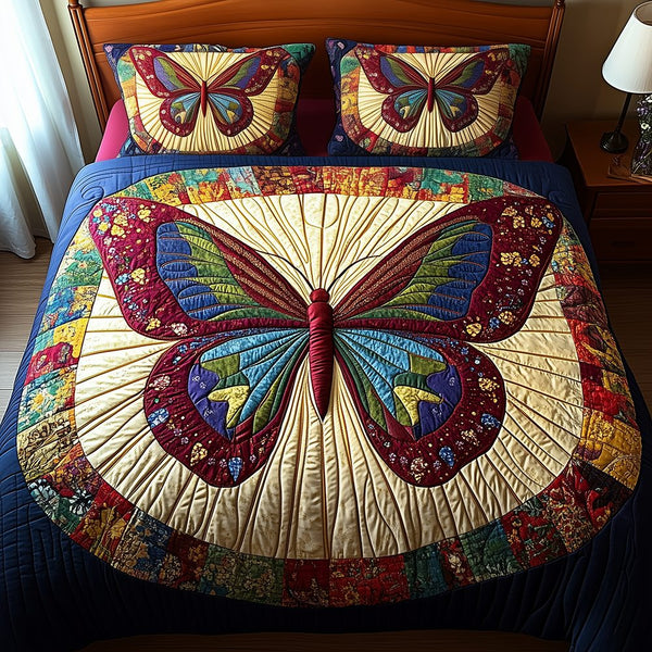 Butterfly Charm quilted 3-piece bedding set on a made bed with two matching pillow shams