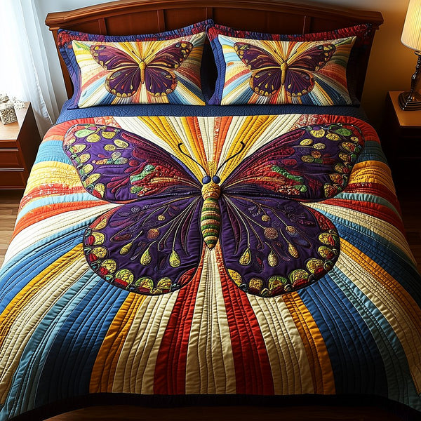 Butterfly Charm quilted 3-piece bedding set on a made bed with two matching pillow shams