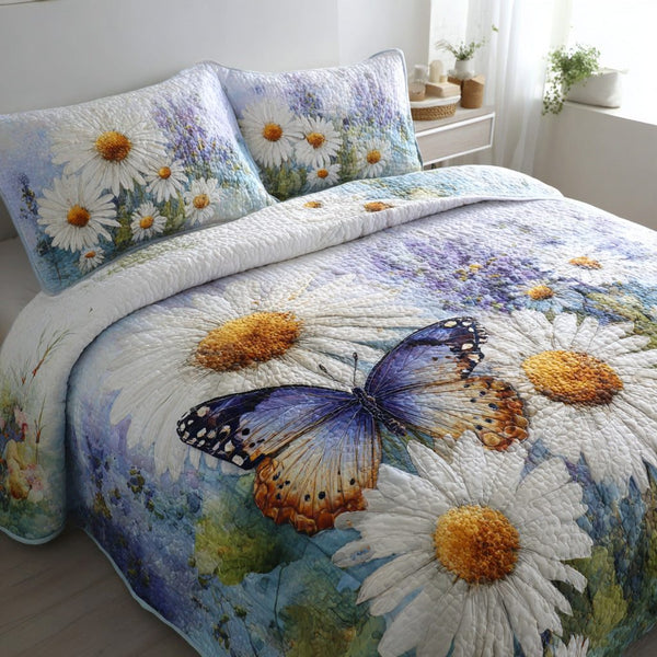 Butterfly Daisy Breeze quilted 3-piece bedding set on a made bed with two matching pillow shams