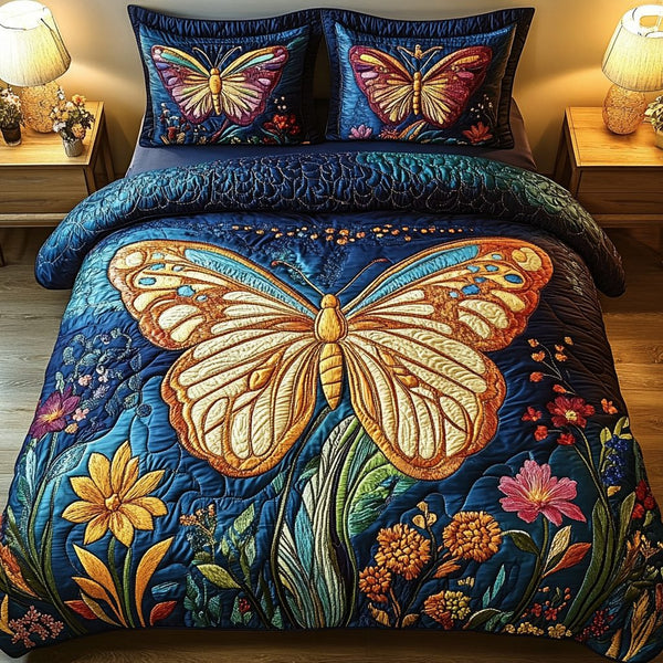 Butterfly Dreams quilted 3-piece bedding set on a made bed with two matching pillow shams