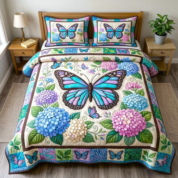 Butterfly Garden quilted 3-piece bedding set on a made bed with two matching pillow shams