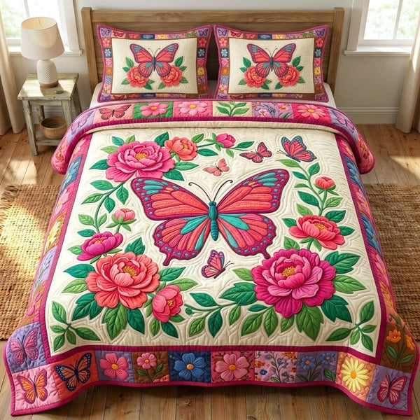Butterfly Garden quilted 3-piece bedding set on a made bed with two matching pillow shams