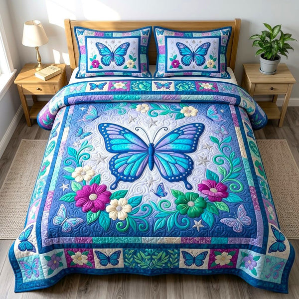 Butterfly Garden quilted 3-piece bedding set on a made bed with two matching pillow shams