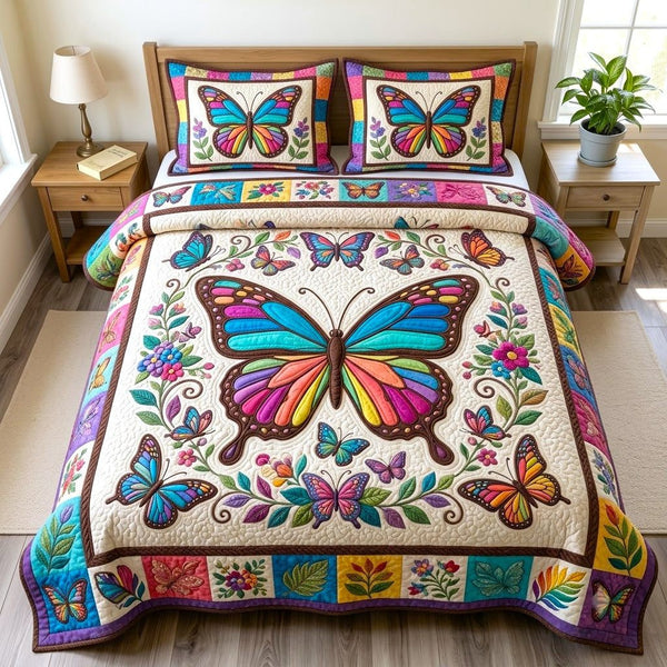 Butterfly Garden quilted 3-piece bedding set on a made bed with two matching pillow shams