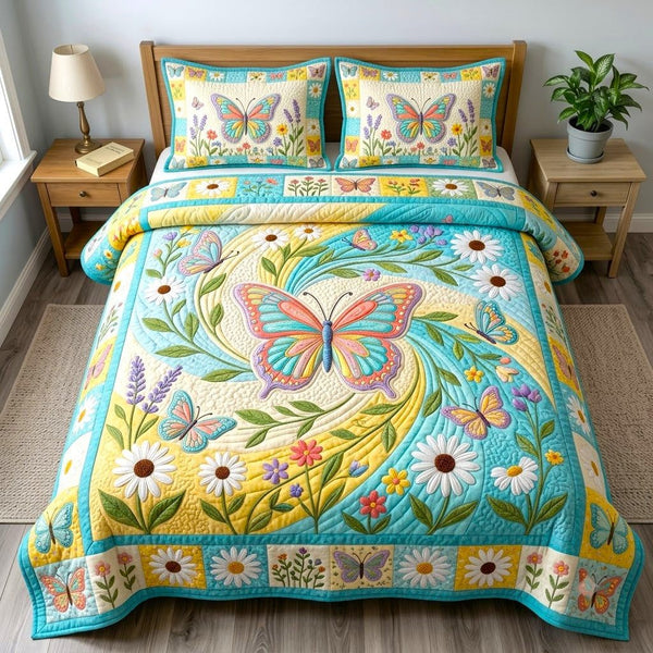 Butterfly Garden quilted 3-piece bedding set on a made bed with two matching pillow shams