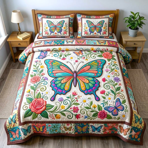 Butterfly Garden quilted 3-piece bedding set on a made bed with two matching pillow shams