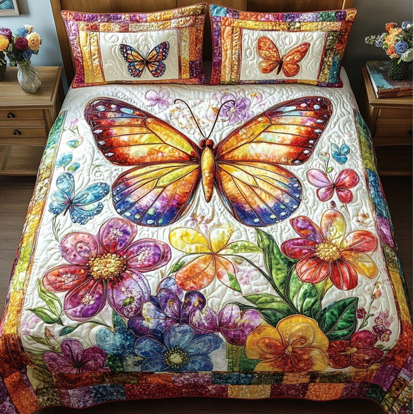 Butterfly Garden quilted 3-piece bedding set on a made bed with two matching pillow shams