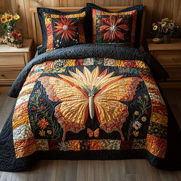 Butterfly Glow quilted 3-piece bedding set on a made bed with two matching pillow shams