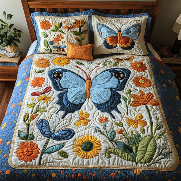 Butterfly Harmony quilted 3-piece bedding set on a made bed with two matching pillow shams