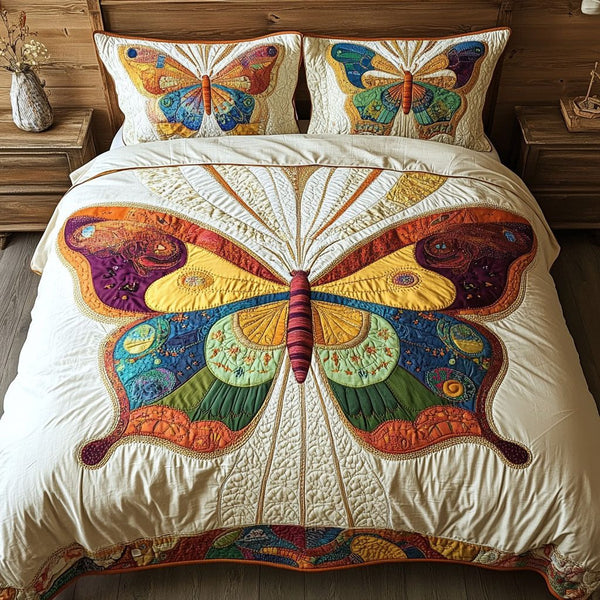 Butterfly Haven quilted 3-piece bedding set on a made bed with two matching pillow shams