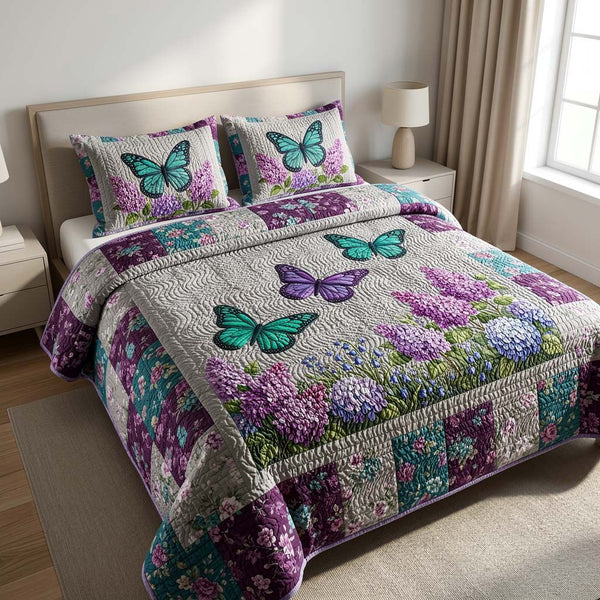 Butterfly Heaven quilted 3-piece bedding set on a made bed in a softly lit bedroom