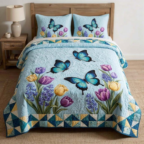 Butterfly Heaven quilted 3-piece bedding set on a made bed in a softly lit bedroom