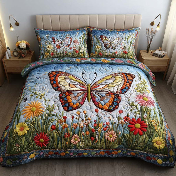 Butterfly Joy quilted 3-piece bedding set on a made bed with two matching pillow shams