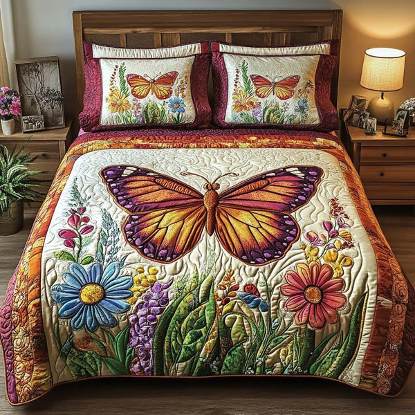 Butterfly Kisses quilted 3-piece bedding set on a made bed with two matching pillow shams