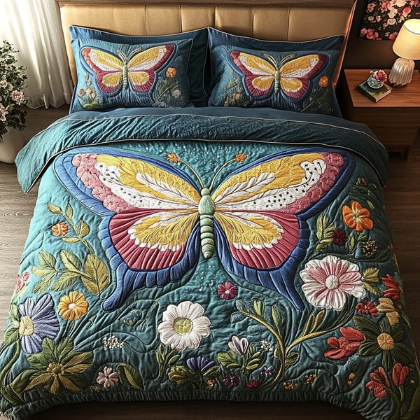 Butterfly Magic quilted 3-piece bedding set on a made bed with two matching pillow shams