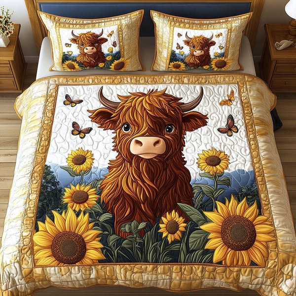 Butterfly Meadow quilted 3-piece bedding set on a made bed with two matching pillow shams