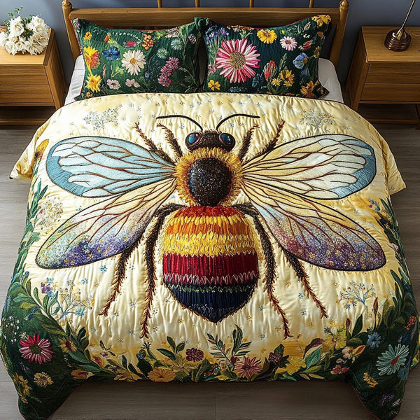 Buzzed Beauty quilted 3-piece bedding set on a made bed with two matching pillow shams