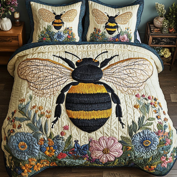 Buzzed Beauty quilted 3-piece bedding set on a made bed with two matching pillow shams