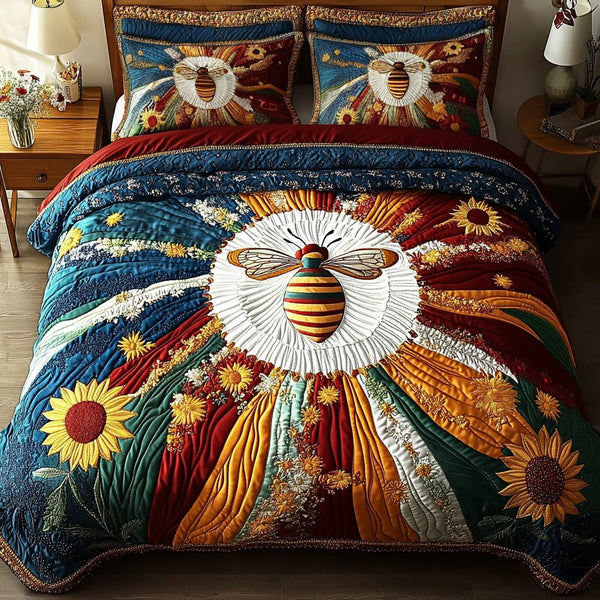 Buzzing Charm quilted 3-piece bedding set on a made bed with two matching pillow shams