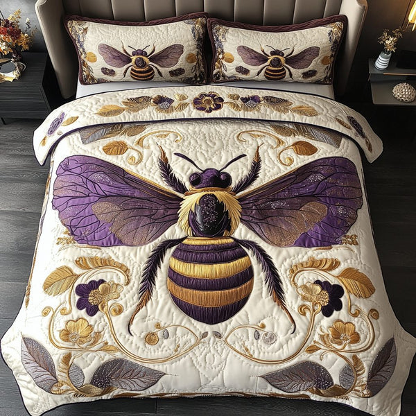 Buzzing Harmony quilted 3-piece bedding set on a made bed with two matching pillow shams
