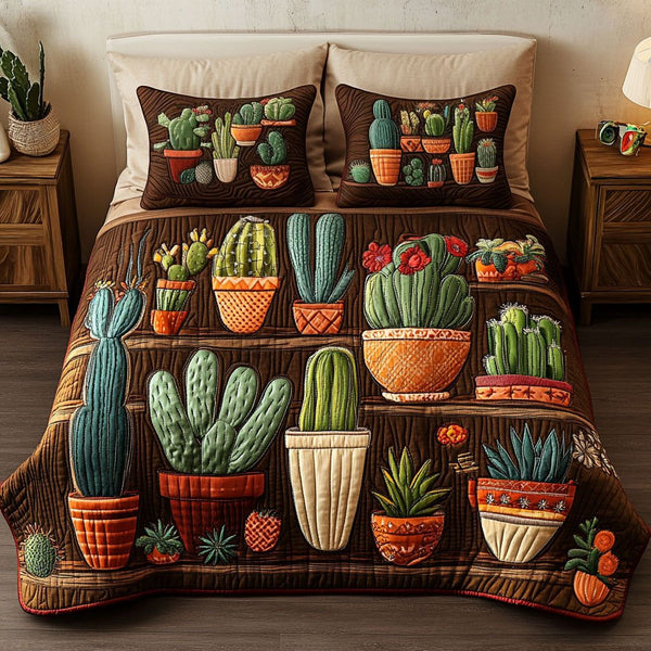 Cactus Arrangement quilted 3-piece bedding set on a made bed with two matching pillow shams