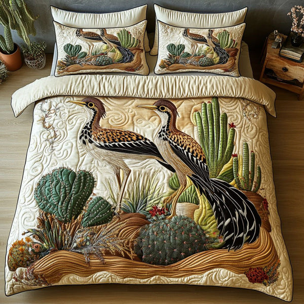 Cactus Dancers quilted 3-piece bedding set on a made bed with two matching pillow shams