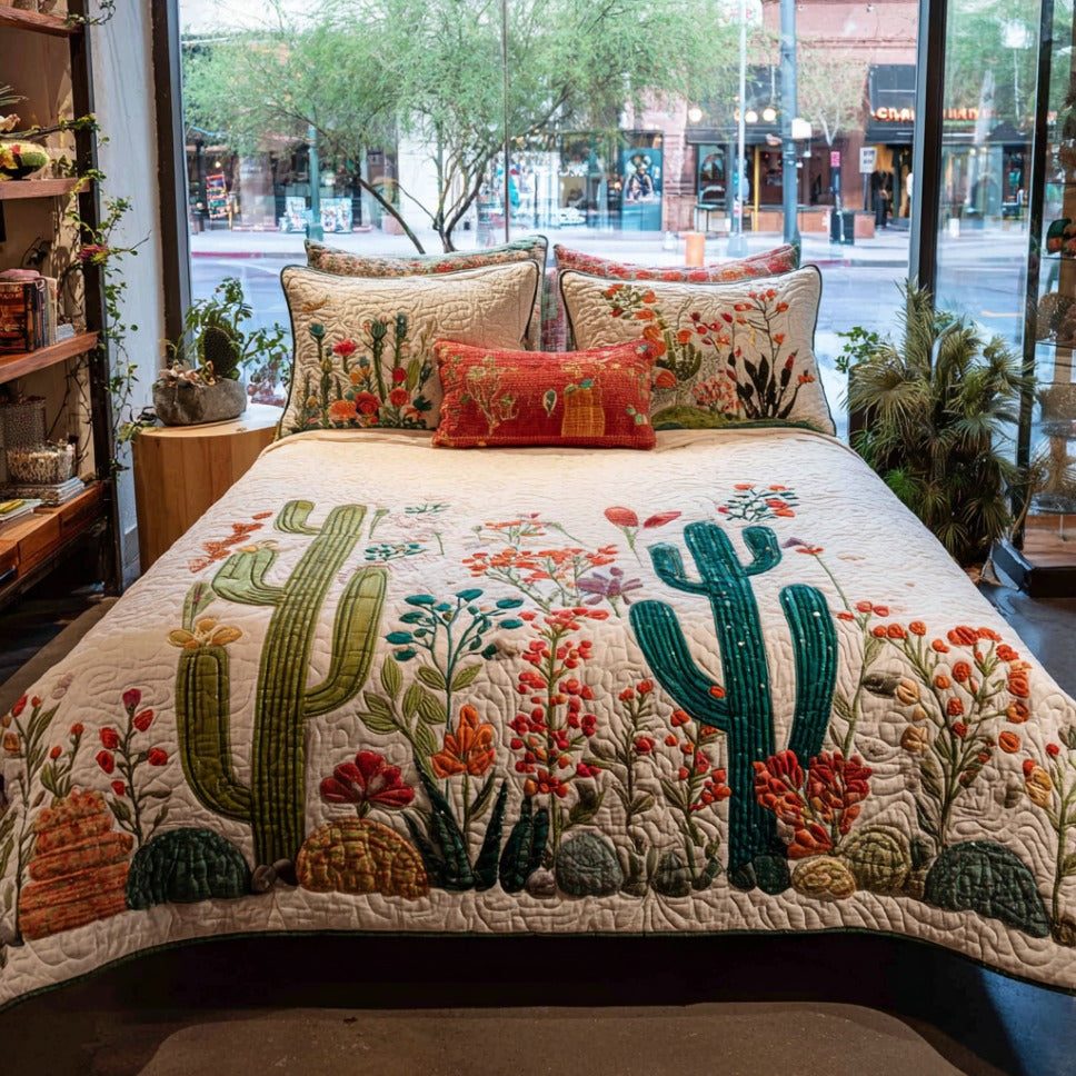 Cactus Haven quilted 3-piece bedding set on a made bed with two matching pillow shams