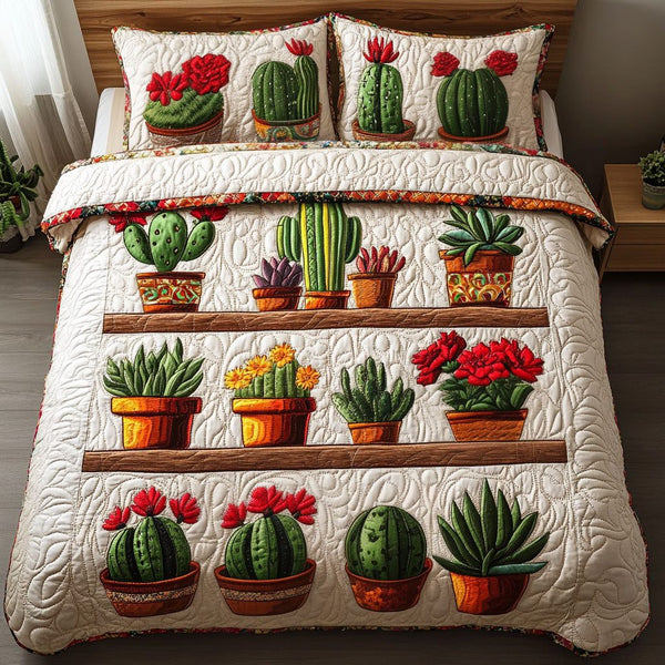 Cactus Pots Display quilted 3-piece bedding set on a made bed with two matching pillow shams