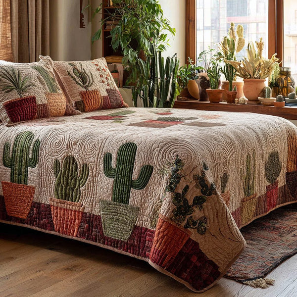 Cactus Serenity quilted 3-piece bedding set on a made bed with two matching pillow shams
