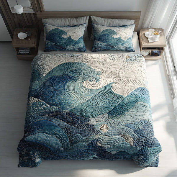 Calming Ocean Waves quilted 3-piece bedding set on a made bed in a light coastal bedroom