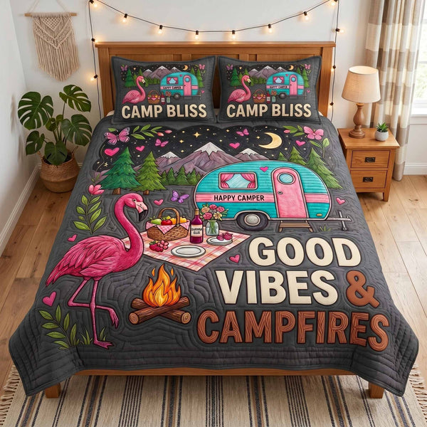 Camp Bliss quilted 3-piece bedding set on a made bed with two matching pillow shams