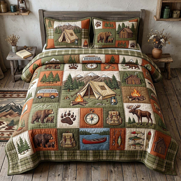 Camp Escape quilted 3-piece bedding set on a made bed with two matching pillow shams
