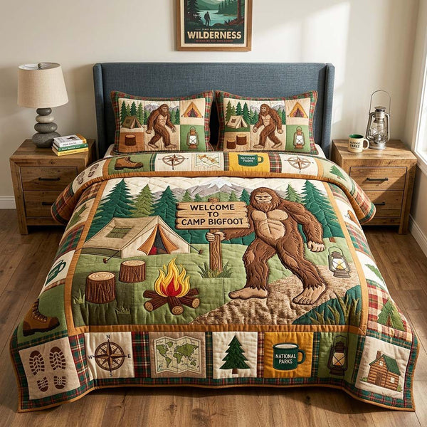Camp Welcome quilted 3-piece bedding set on a made bed with two matching pillow shams
