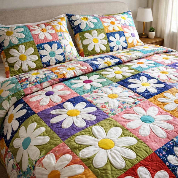 Candy Daisy quilted 3-piece bedding set on a made bed with two matching pillow shams