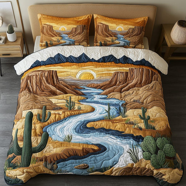 Canyon Bliss quilted 3-piece bedding set on a made bed with two matching pillow shams