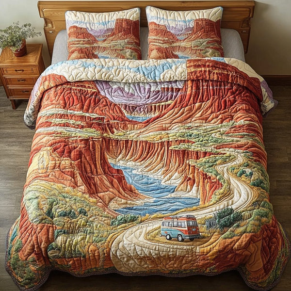 Canyon Dreams quilted 3-piece bedding set on a made bed with two matching pillow shams