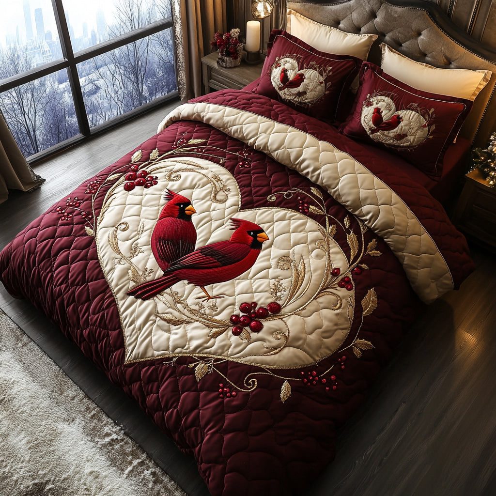 Cardinal Blessing quilted 3-piece bedding set on a made bed with two matching pillow shams