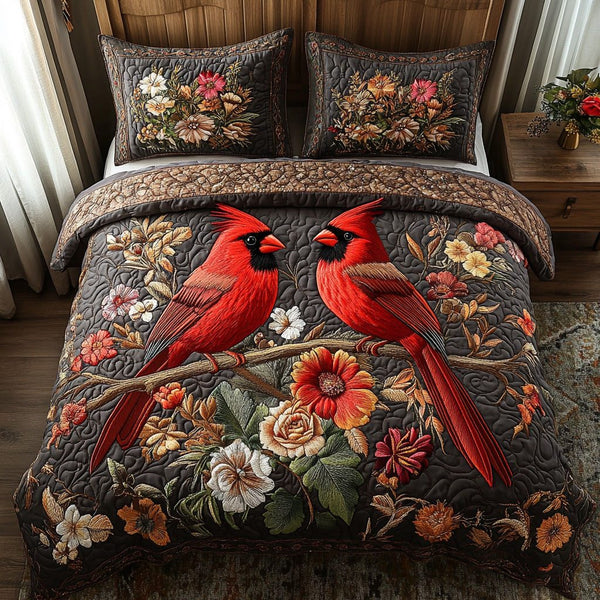 Cardinal Bloom quilted 3-piece bedding set on a made bed with two matching pillow shams