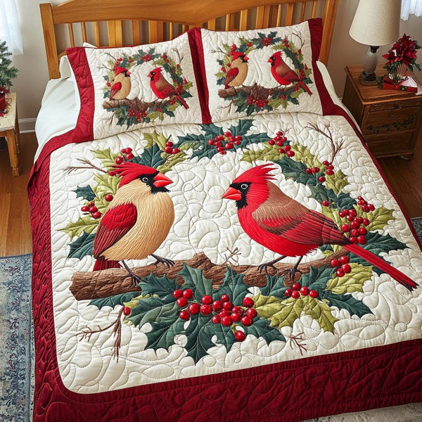 Cardinal Charm quilted 3-piece bedding set on a made bed with two matching pillow shams