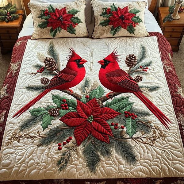 Cardinal Cheer quilted 3-piece bedding set on a made bed with two matching pillow shams