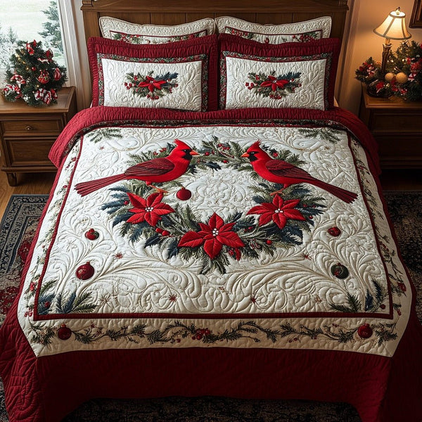 Cardinal Chorus quilted 3-piece bedding set on a made bed with two matching pillow shams