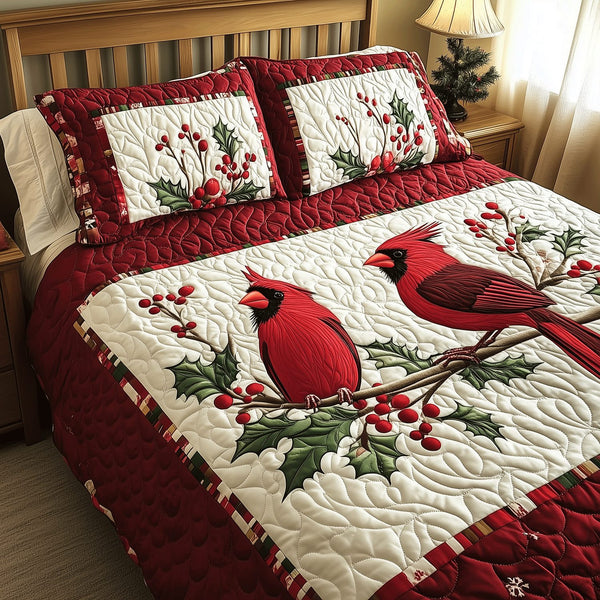 Cardinal Couple Delight quilted 3-piece bedding set on a made bed with two matching pillow shams