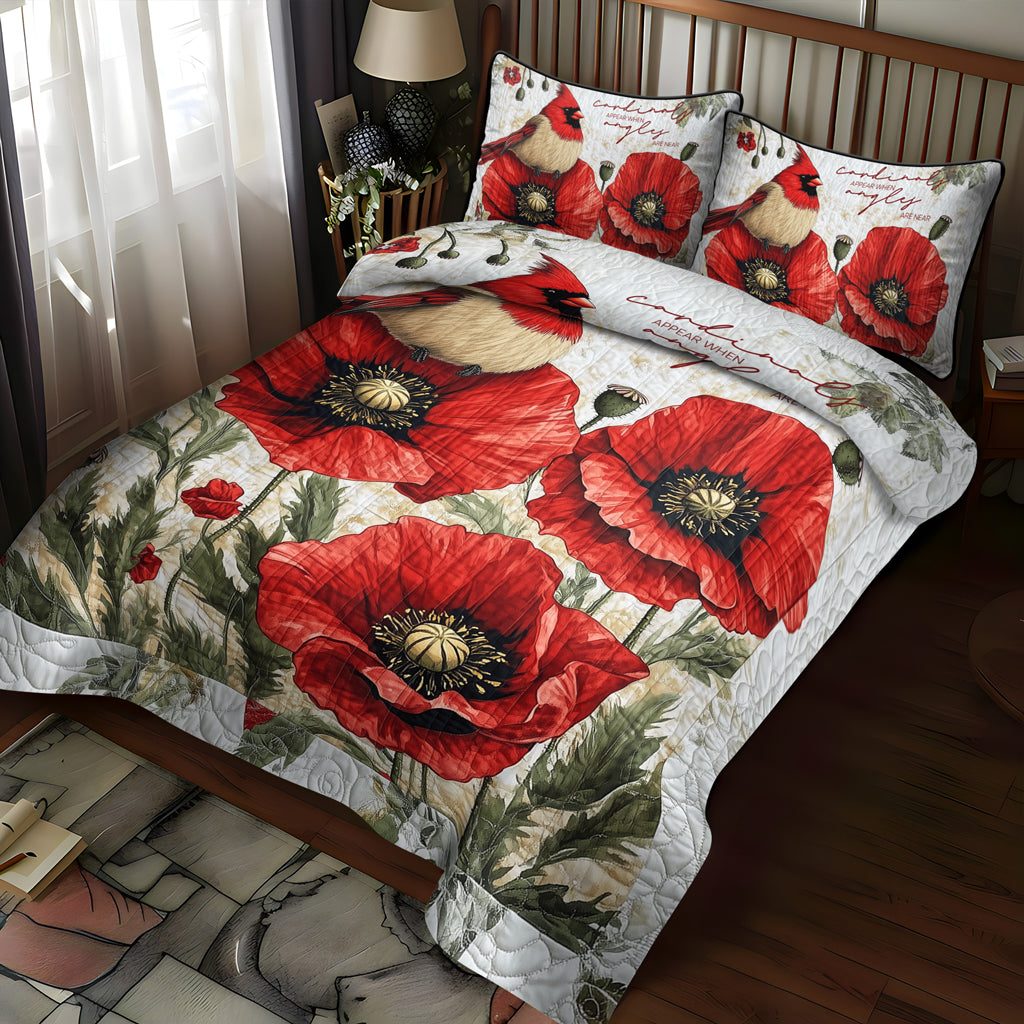 Cardinal Couple quilted 3-piece bedding set on a made bed with two matching pillow shams