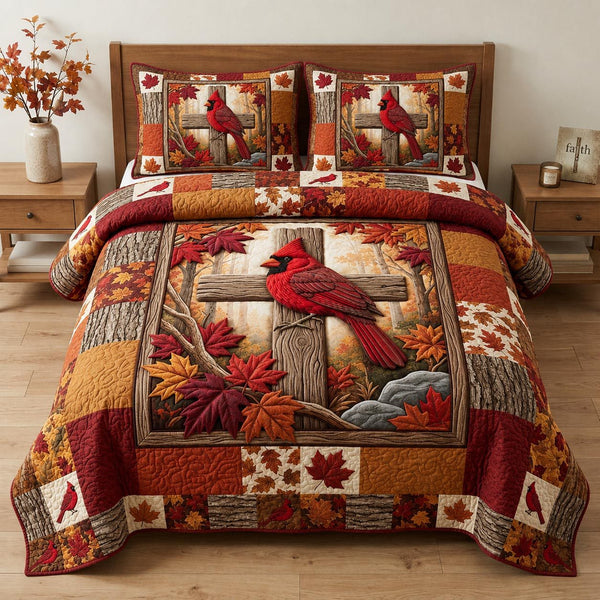 Cardinal Cross Autumn quilted 3-piece bedding set on a made bed in a softly lit bedroom
