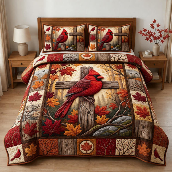 Cardinal Cross Autumn quilted 3-piece bedding set on a made bed in a softly lit bedroom