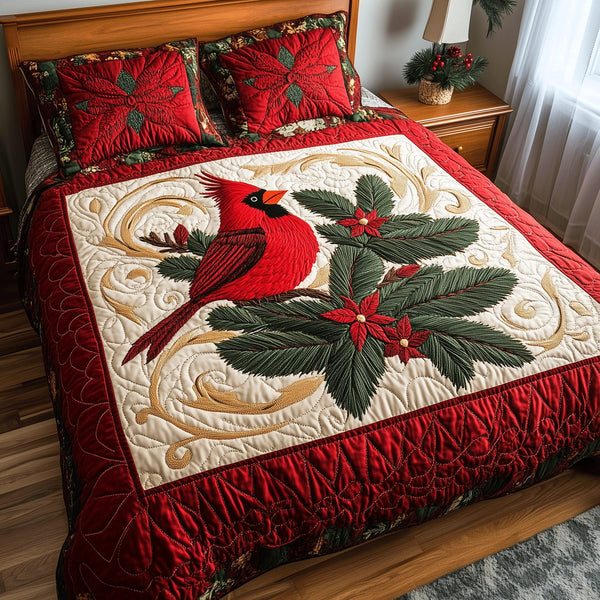 Cardinal Dreams quilted 3-piece bedding set on a made bed with two matching pillow shams