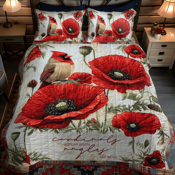 Cardinal Dreams quilted 3-piece bedding set on a made bed with two matching pillow shams