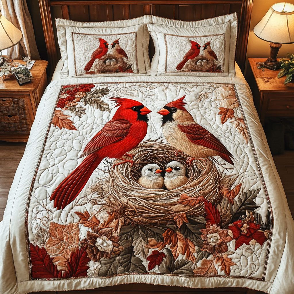 Cardinal Family Nest quilted 3-piece bedding set on a made bed with two matching pillow shams