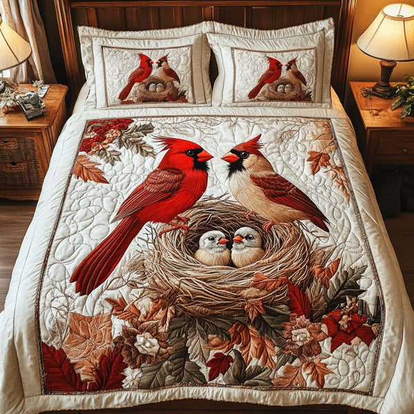 Cardinal Family Nest quilted 3-piece bedding set on a made bed with two matching pillow shams