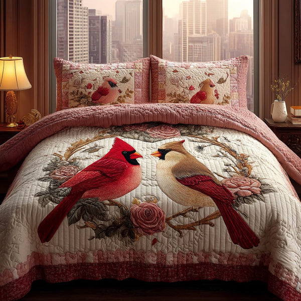 Cardinal Glow quilted 3-piece bedding set on a made bed with two matching pillow shams